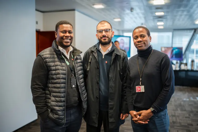 Three participants pose together after the pitches.