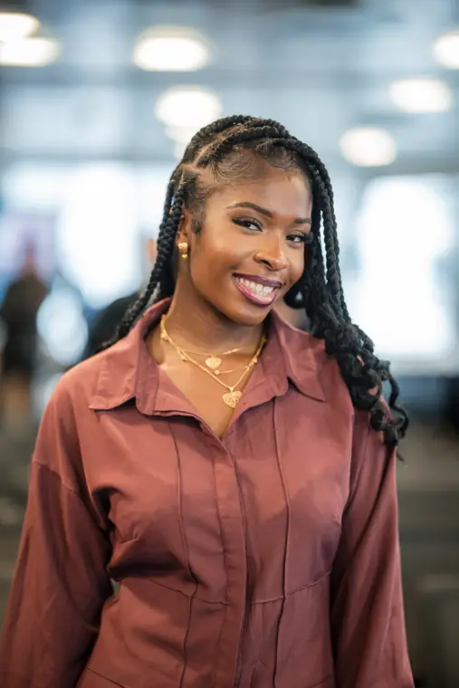 A founder poses for a portrait in the event space.