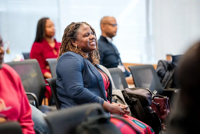 An audience member listens during the programme.