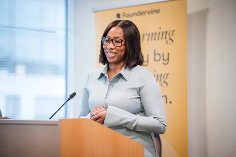 A founder speaks from the Foundervine lectern.