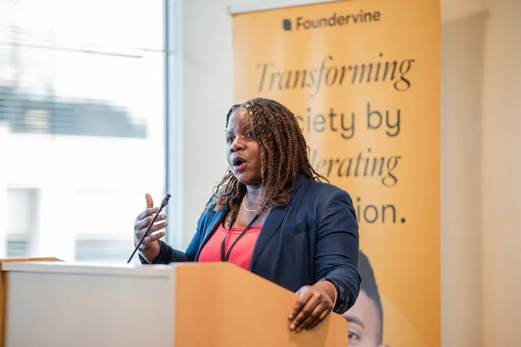 A speaker opens the showcase from the Foundervine lectern.