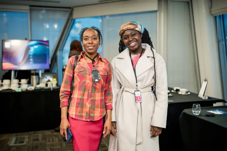 Two guests pose together after the presentations.