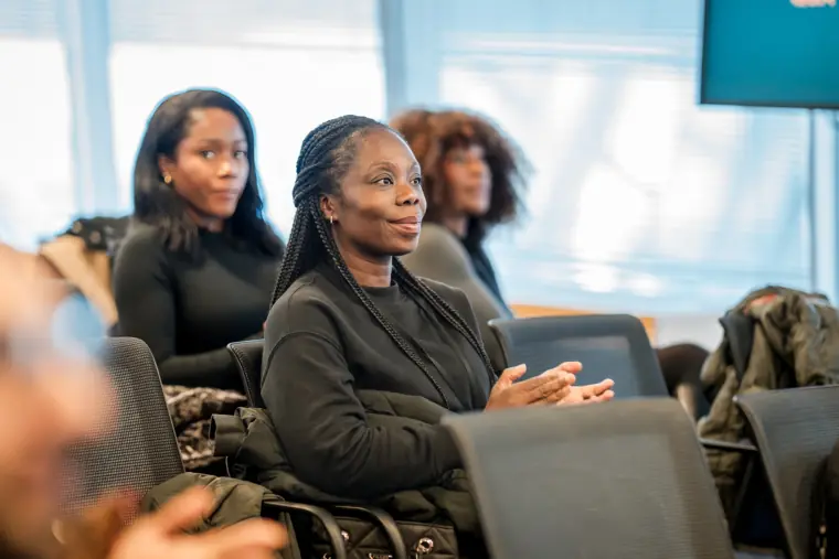 Attendees listen closely during a showcase talk.