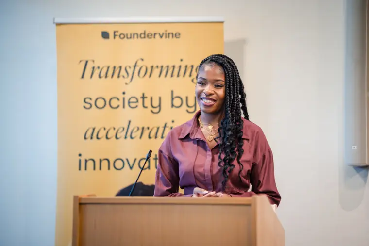 A participant speaks at the Foundervine lectern.