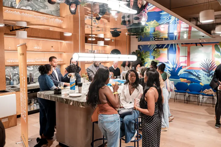 Guests meet in the open networking area.