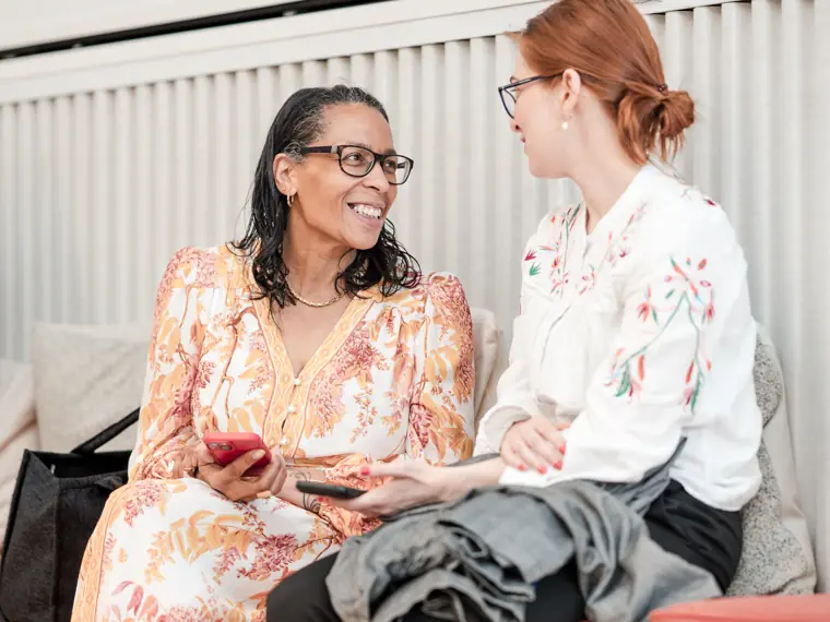Two guests share a conversation at the venue.