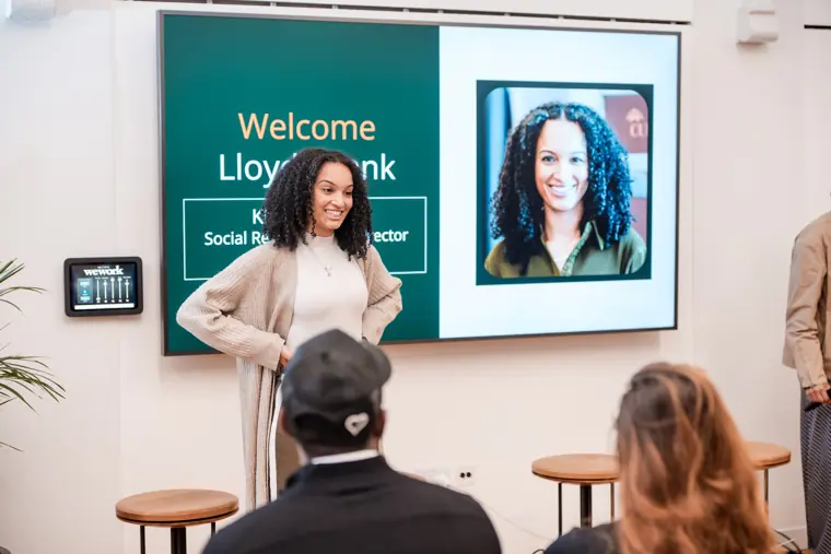 A founder introduces her business on stage.