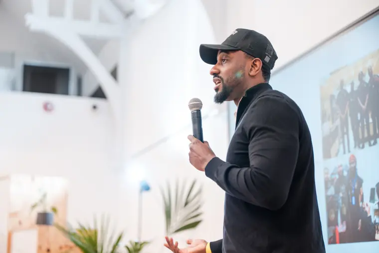 A speaker shares a lesson with the audience.
