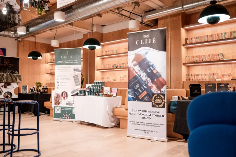 Founder stalls line the networking space.