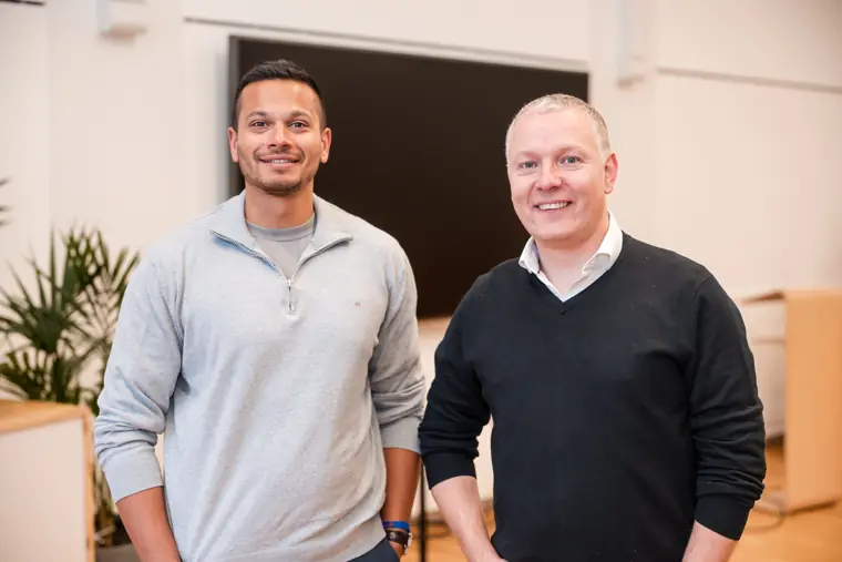 Two men pause for a portrait at the event.