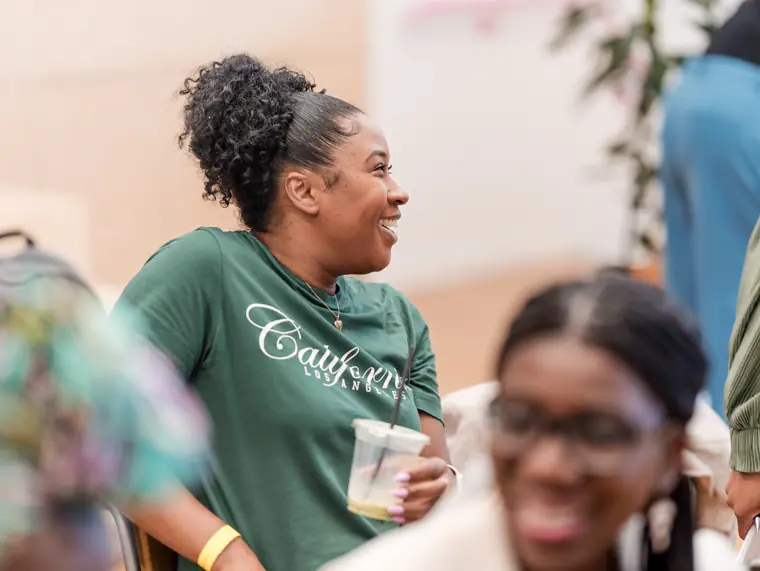 An attendee speaks with a founder in the crowd.