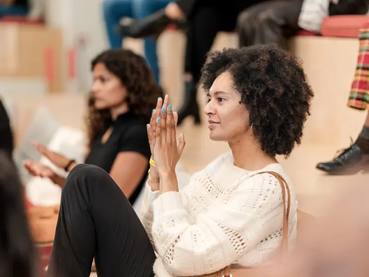An attendee listens closely to the presentation.