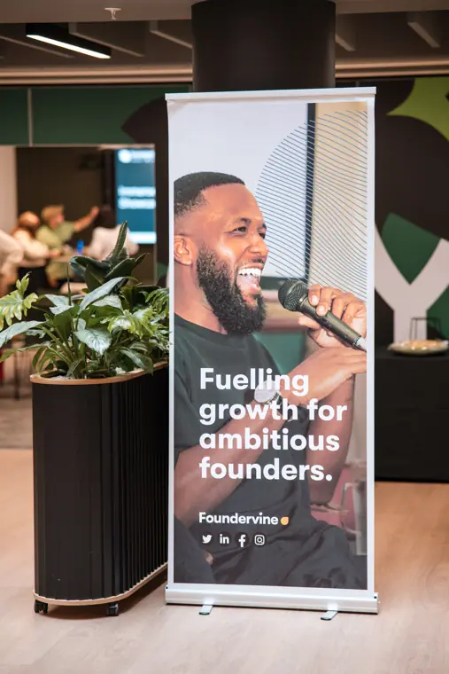 A Foundervine welcome display in the event space.