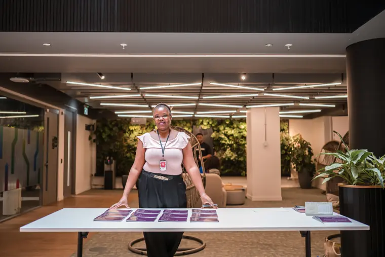 An organiser prepares the welcome table.