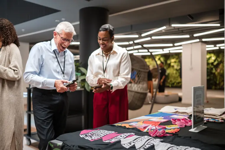 Guests exchange details at a founder table.