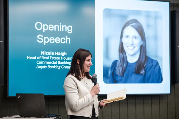 A Lloyds Banking Group speaker welcomes the audience.