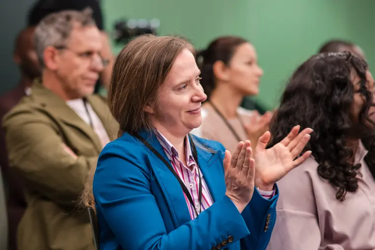 A guest contributes to the audience discussion.