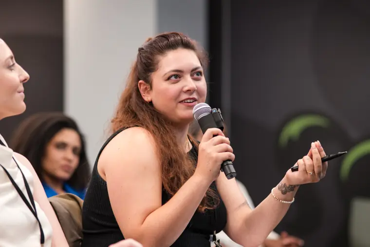 A question is put to a founder on stage.