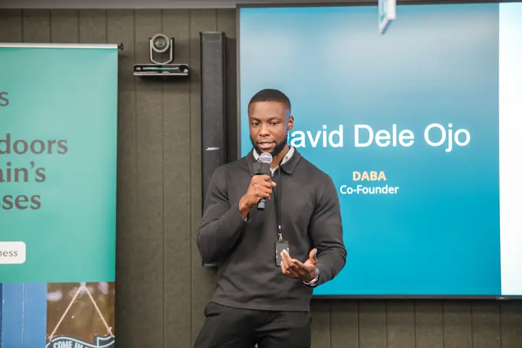 A founder delivers his pitch on stage.