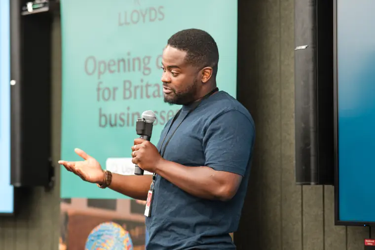 A founder explains a point during his pitch.