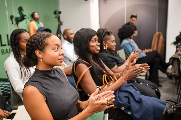 Attendees applaud the founder presentations.