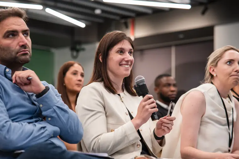 An attendee asks a question of the founders.