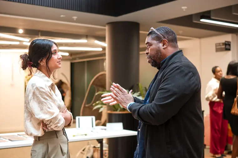 Two guests talk during the networking break.