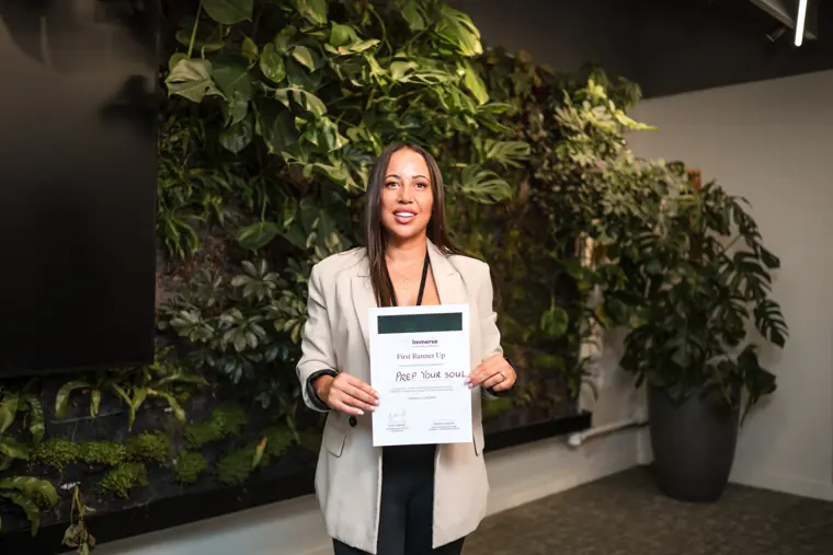An award recipient holds her certificate.