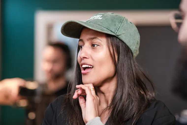 A guest reacts during a conversation.
