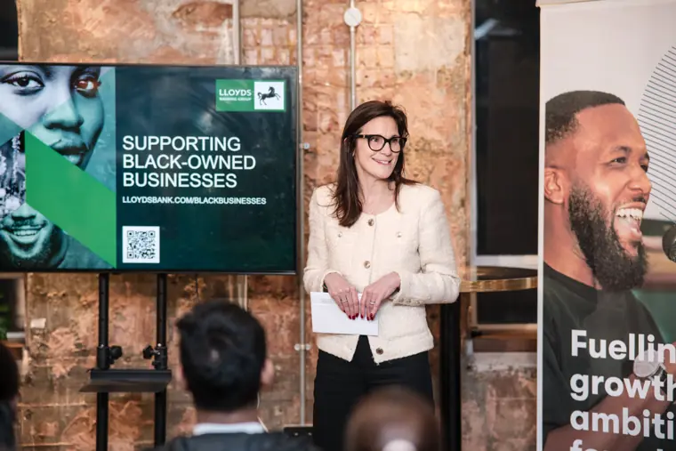 A speaker addresses founders and guests.