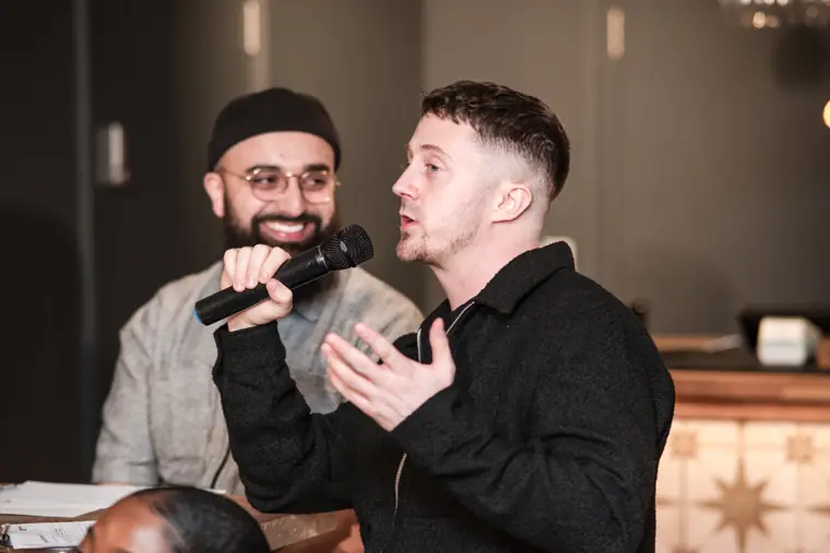 Two judges discuss a founder’s pitch.