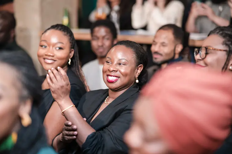 Guests react to a moment on stage.