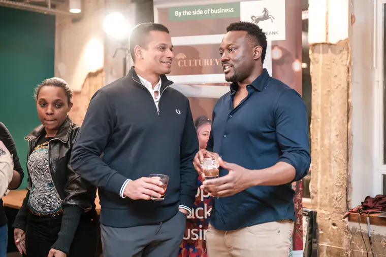 Two guests connect during networking.