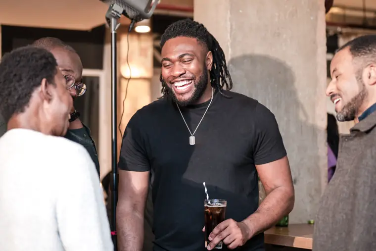 A founder laughs during a conversation.