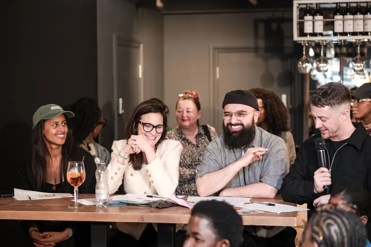 The judging panel listens to a response.