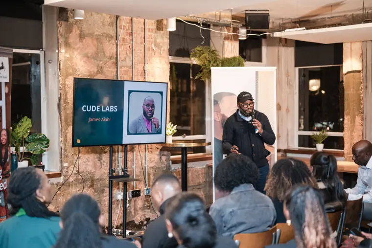 Guests watch a founder speak at the event.