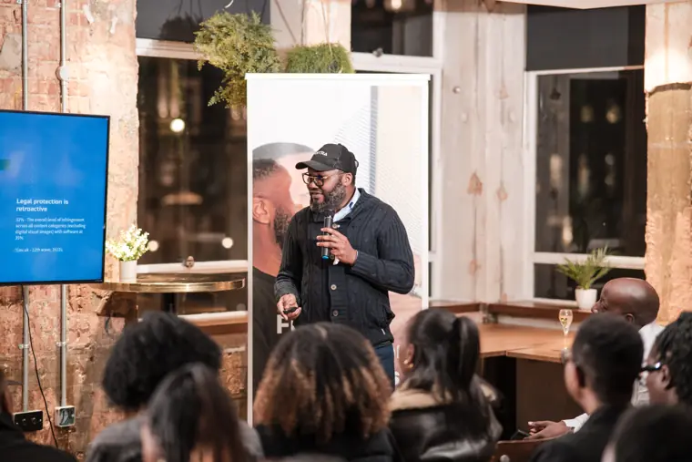 A founder addresses the room during the pitch night.