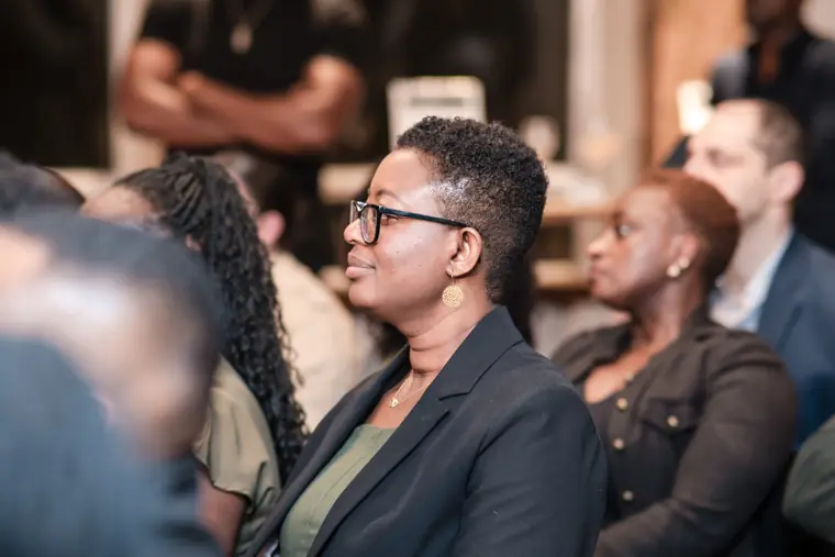 Guests listen closely to the pitch presentations.