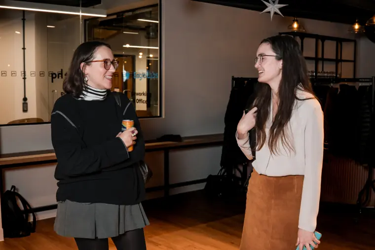 Two attendees connect after the programme.