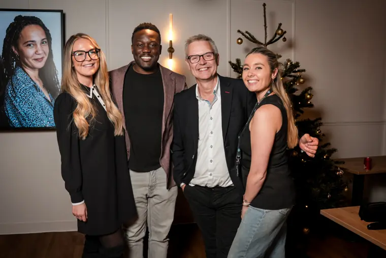The judging panel and guests gather for a photo.