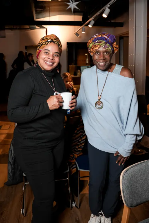 Two guests pose together at The Pitch Room.