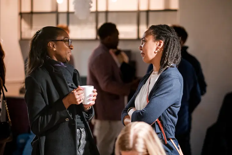 Two guests connect at the venue.
