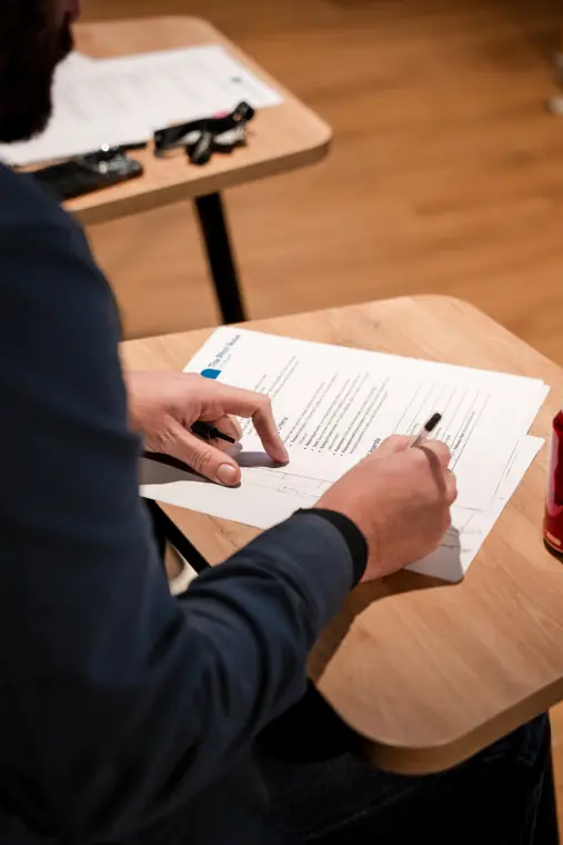 A judge takes notes during the pitches.