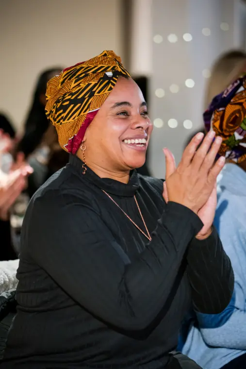 A guest applauds a founder.