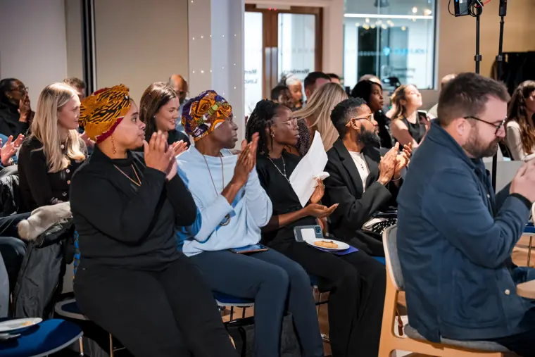 The audience applauds the programme.