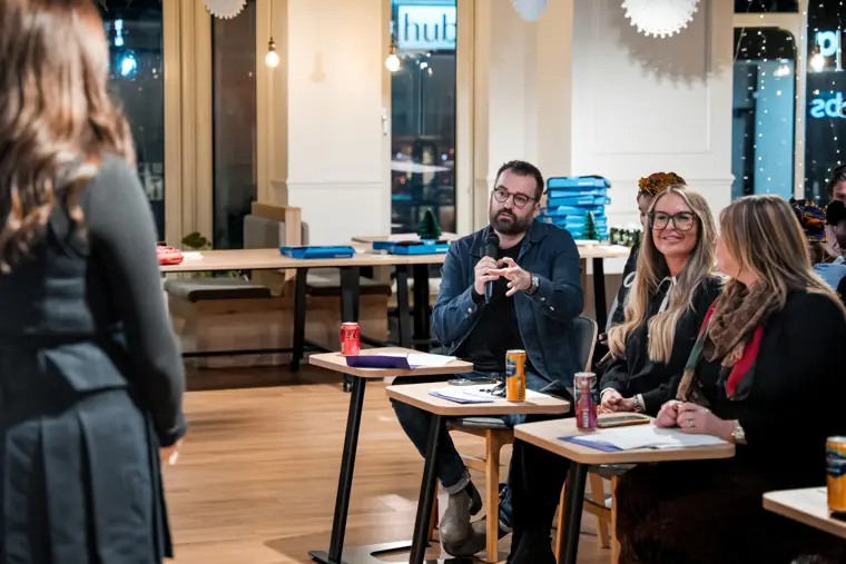 Judges discuss the founder presentations.