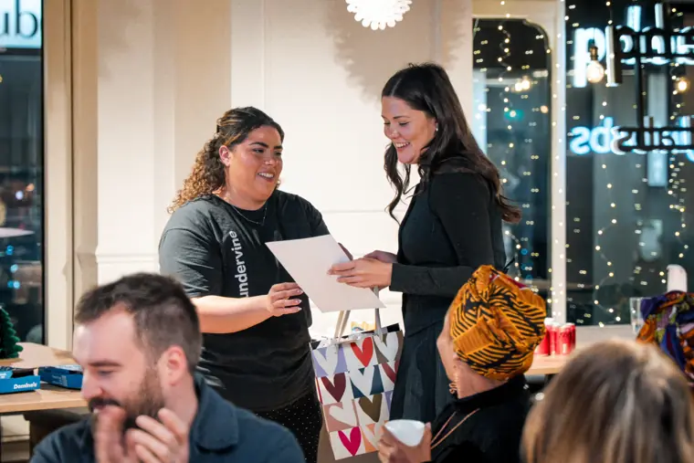 A founder receives her award on stage.