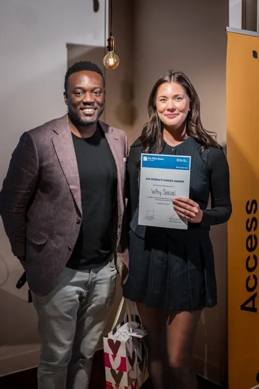 A founder poses with her certificate.
