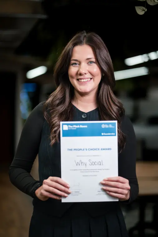An award recipient poses with her certificate.