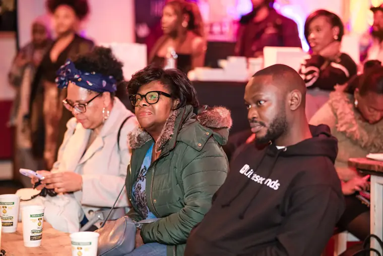 Audience members respond to the discussion.